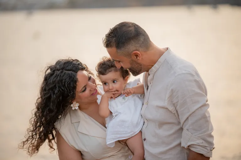 Family portrait on the beach, photograph by Carlos Norte